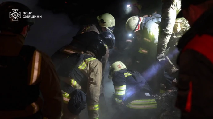 Rescue workers release footage of releasing bodies of those killed in Russian attack on Sumy – video